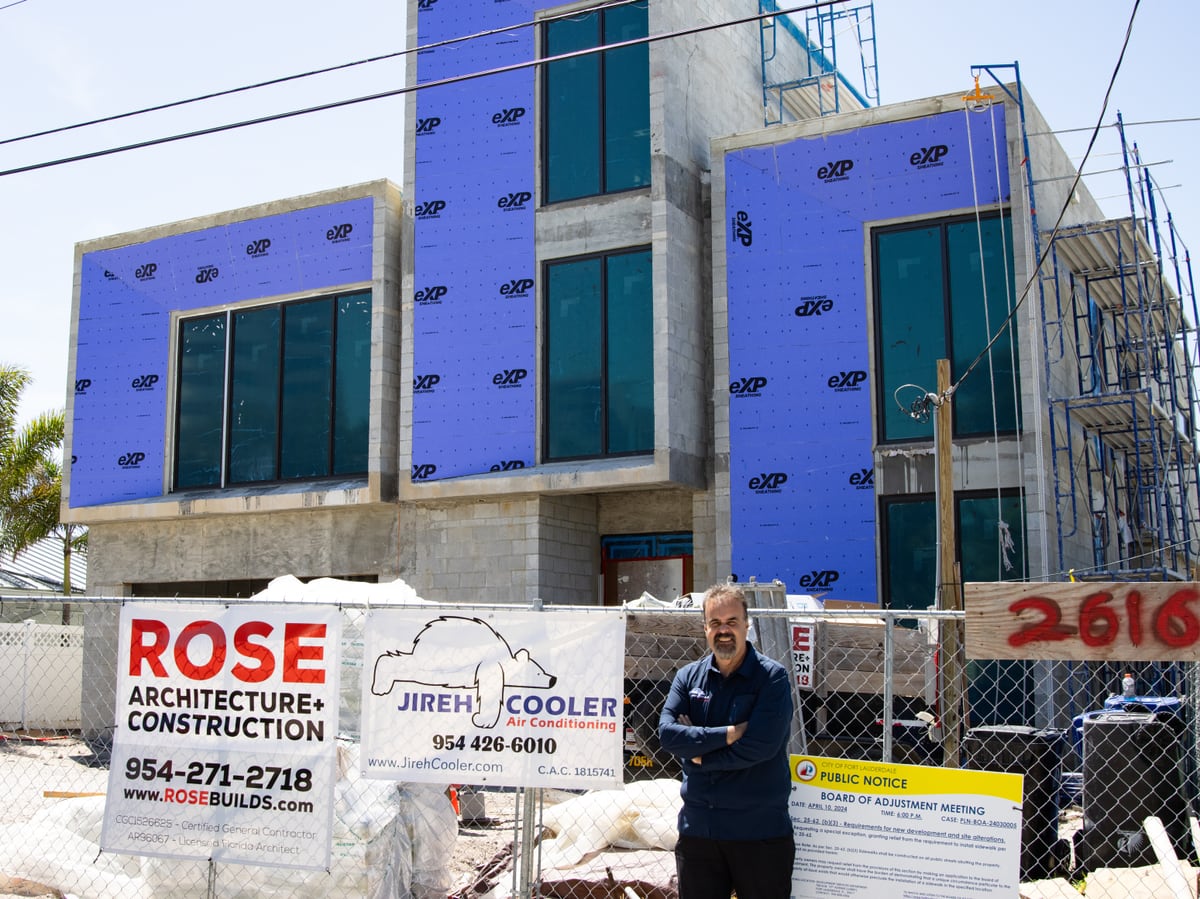 Jireh Cooler signage at a new construction jobsite alongside the project's general contractor