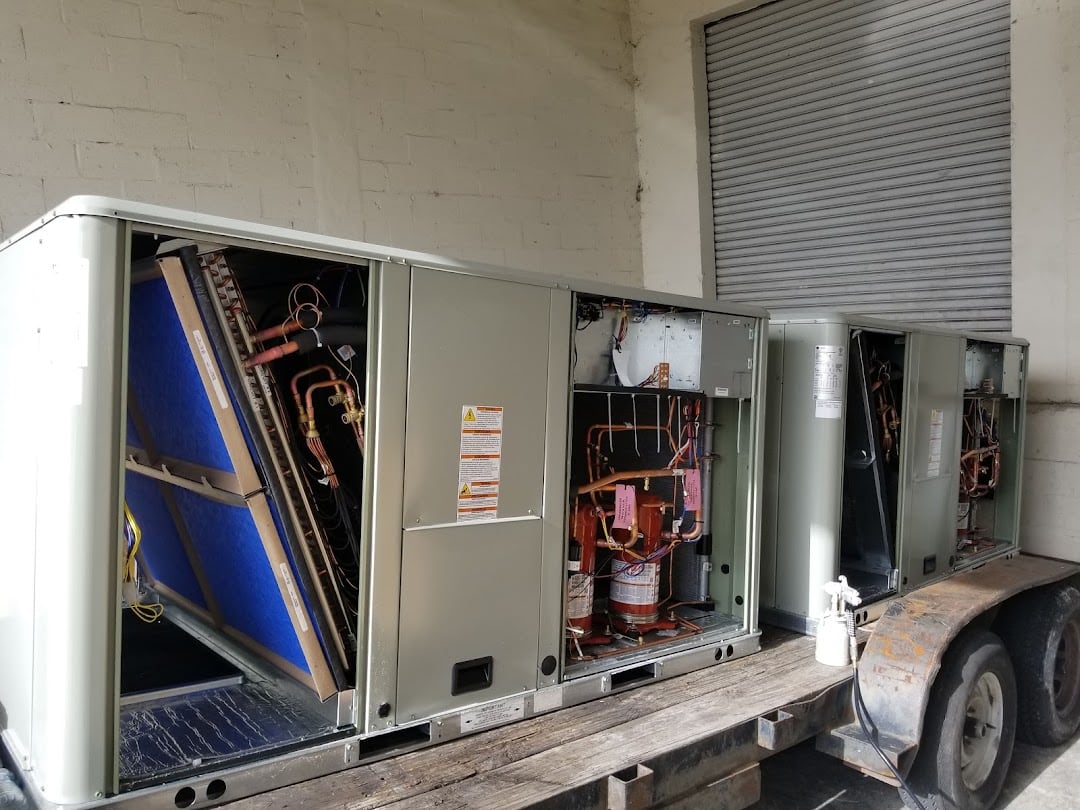 Commercial package HVAC units staged and ready for a Jireh Cooler installation