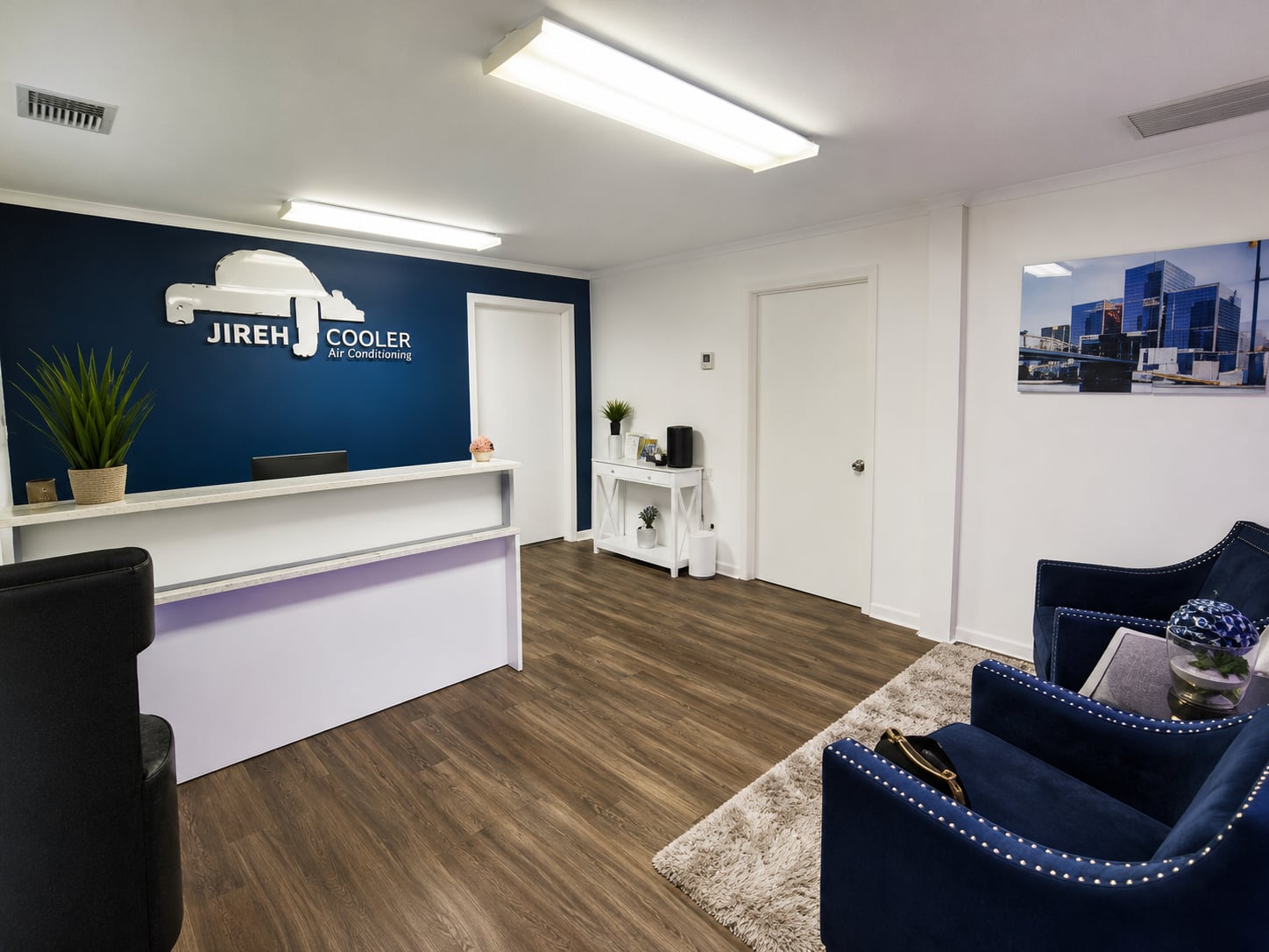 Jireh Cooler office reception area with the company logo on the accent wall