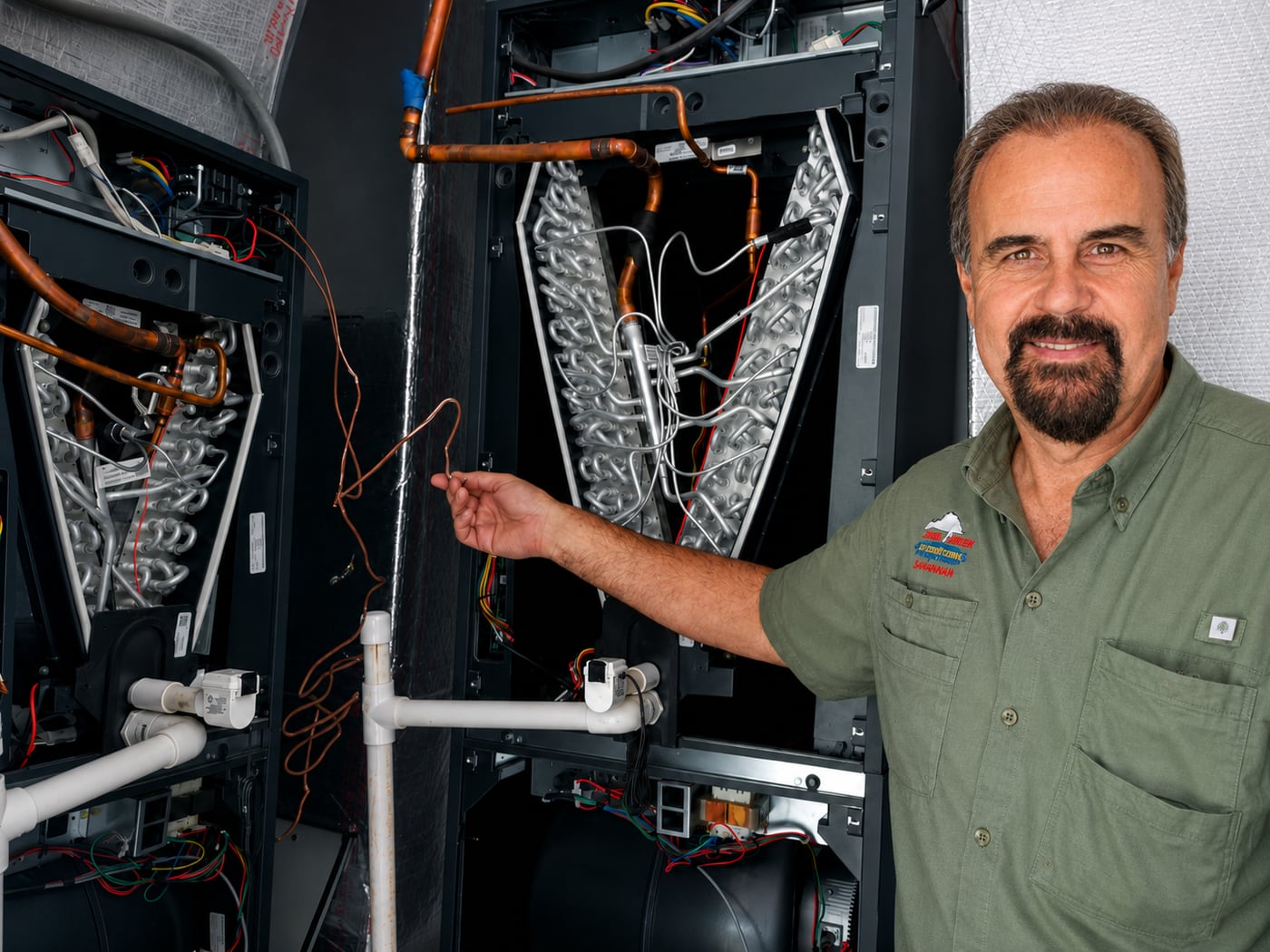 Jireh Cooler technician diagnosing and repairing an indoor HVAC air handler unit