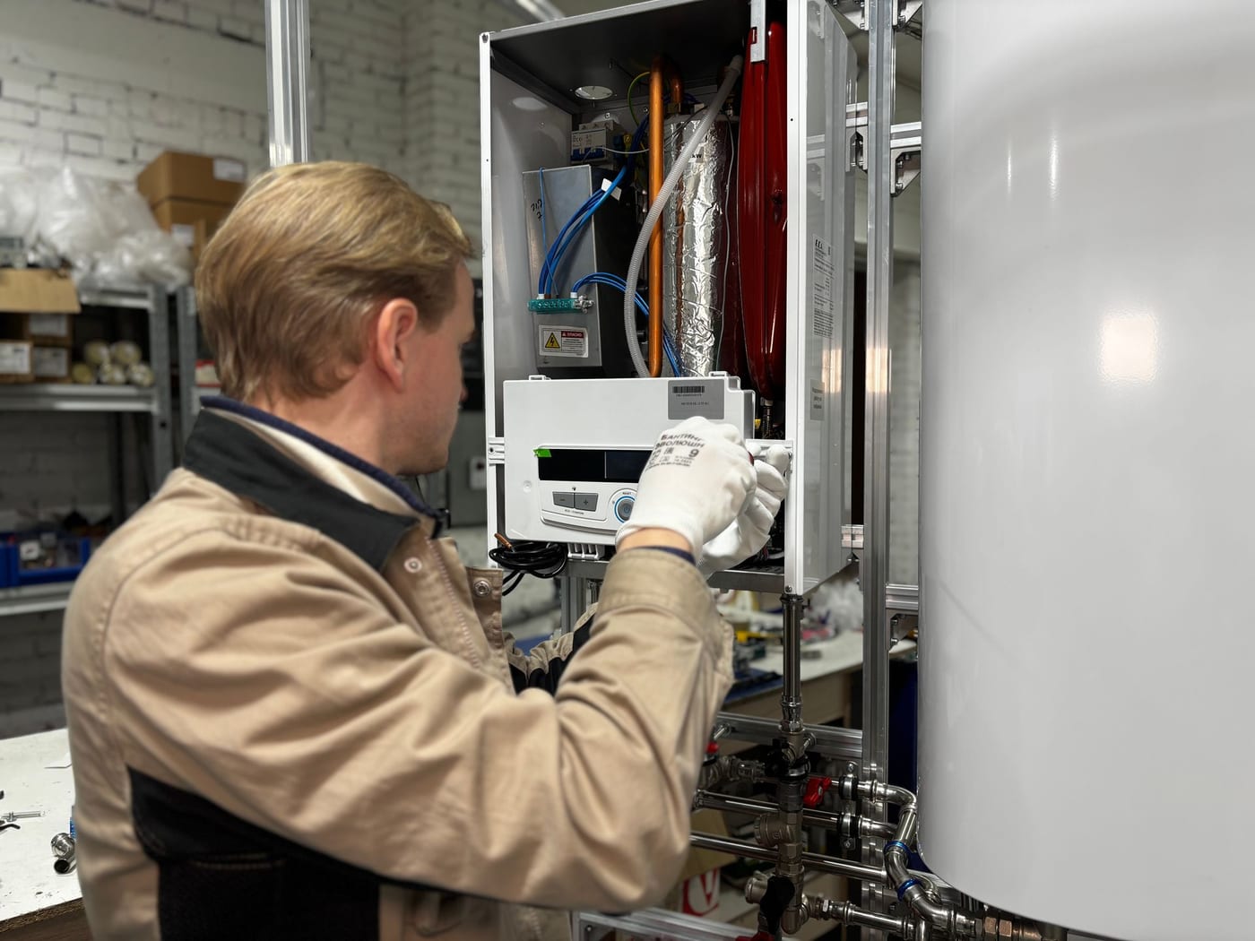 Technician installing a residential water heating system